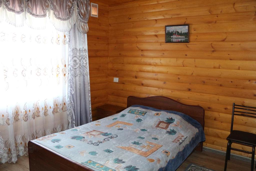 ЧЕТЫРЕХМЕСТНЫЙ В ДЕРЕВЯННОМ СТИЛЕ. Гостевой дом "Сибирячка". Ольгинка