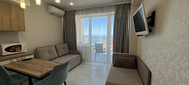 Квартира в многоквартирном доме Светлая студия на первой береговой линии