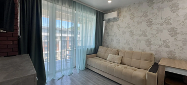 Квартира в многоквартирном доме Светлая студия с шикарным видом на морской закат