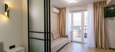 Квартира в многоквартирном доме Квартира на первой линии с отдельной спальней