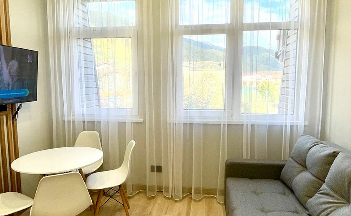 Апартаменты Red Glade. Квартира в многоквартирном доме Двухуровневая студия. Красная Поляна