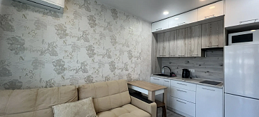 Квартира в многоквартирном доме Светлая студия с шикарным видом на морской закат