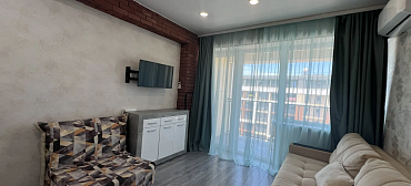 Квартира в многоквартирном доме Светлая студия с шикарным видом на морской закат