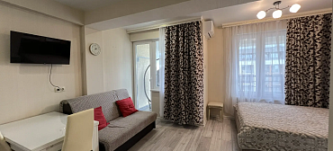 Квартира в многоквартирном доме Стильный апартамент с красивым видом на море и горы