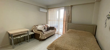 Квартира в многоквартирном доме Уютная студия на первой береговой 