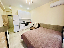 Квартира в многоквартирном доме Светлая студия у моря с террасой