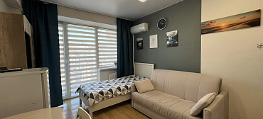 Квартира в многоквартирном доме Стильная студия у моря с видом на горы