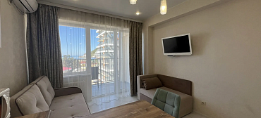 Квартира в многоквартирном доме Светлая студия на первой береговой линии