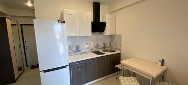 Квартира в многоквартирном доме Уютная студия на первой береговой 