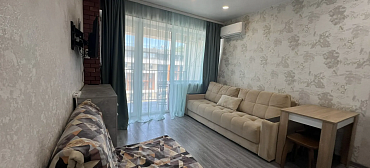 Квартира в многоквартирном доме Светлая студия с шикарным видом на морской закат