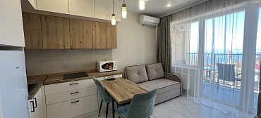 Квартира в многоквартирном доме Светлая студия на первой береговой линии