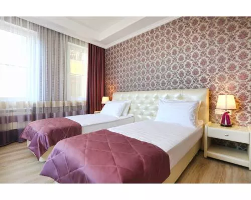 Улучшенный двухместный номер с 1 кроватью или 2 отдельными кроватями . Гостевой дом Tutu. Адлер