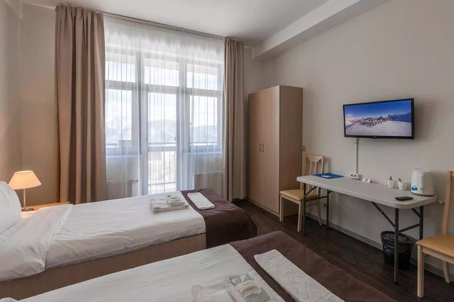 Делюкс в главном корпусе. Отель "Rosa Ski Inn"   . Красная Поляна