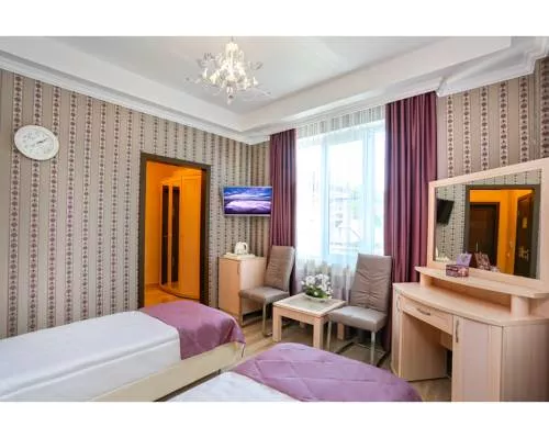 Улучшенный двухместный номер с 1 кроватью или 2 отдельными кроватями . Гостевой дом Tutu. Адлер